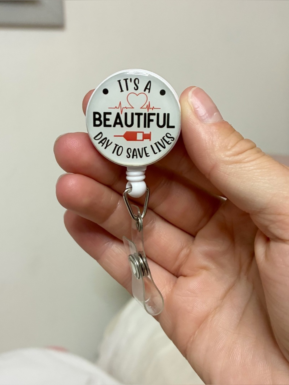“It’s a beautiful day to save lives” badge reel